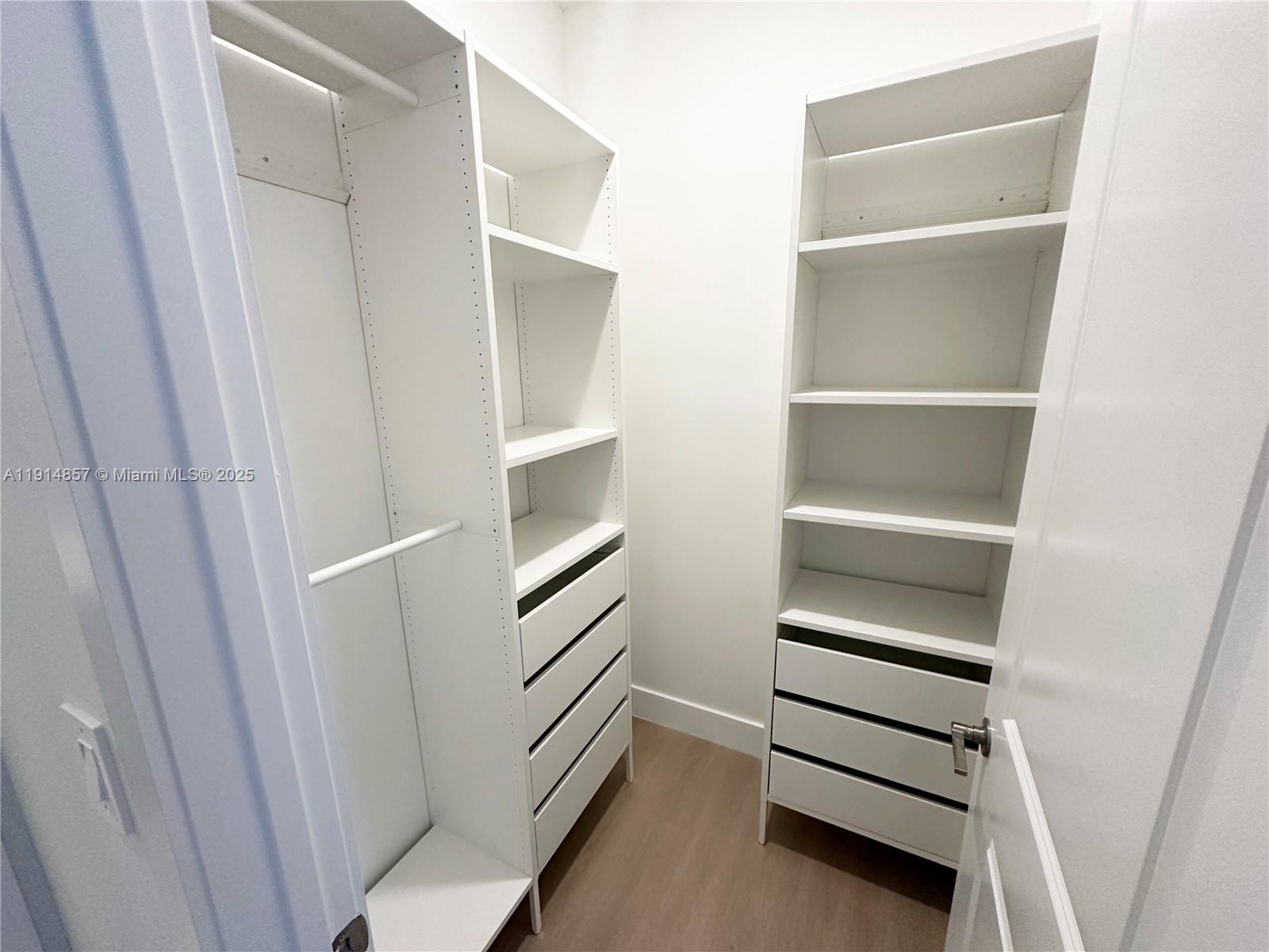 12273 Southwest 44th Street Davie, FL 33330 - Photo 22 of 31 a view of walk in closet with empty racks