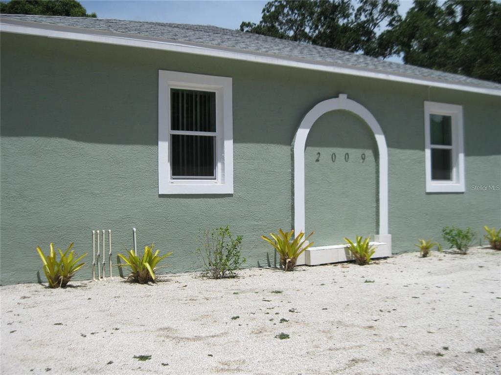 a front view of a house with a backyard