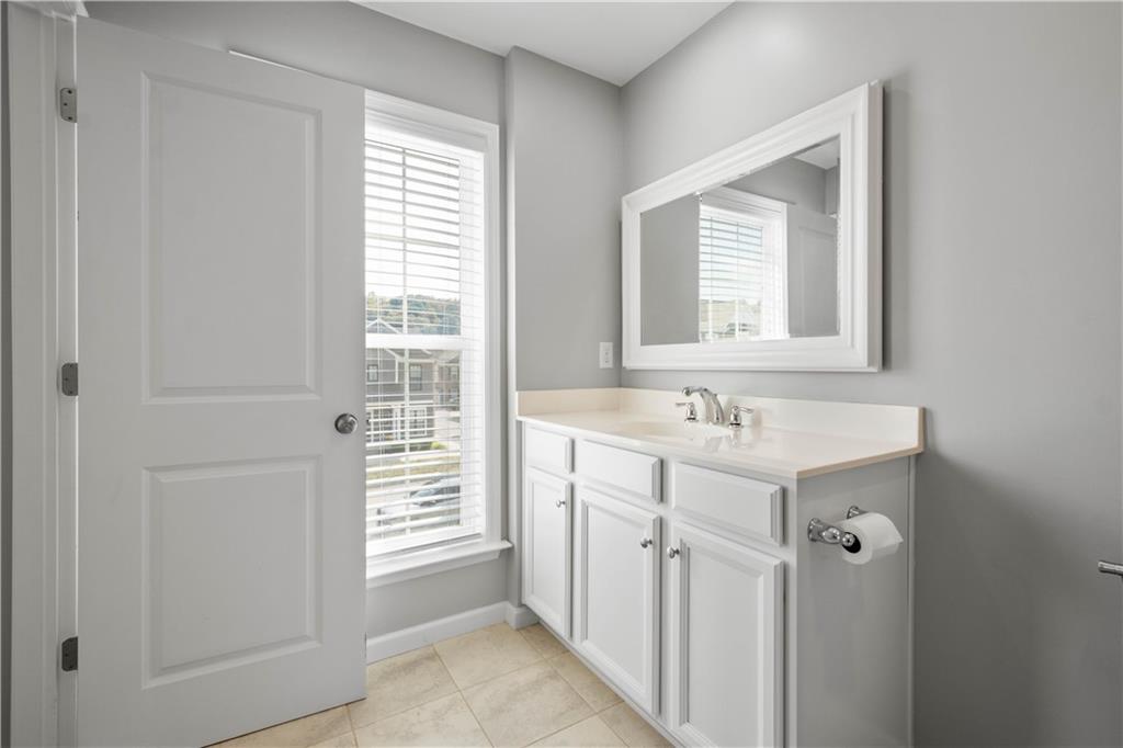 2013 Ashton Row Bridgeville, PA 15017 - Photo 20 of 33 a bathroom with a sink a mirror and a window
