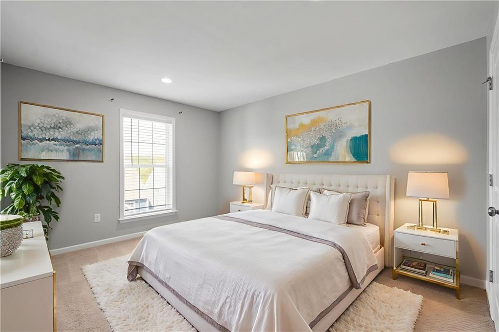 2013 Ashton Row Bridgeville, PA 15017 - Photo 21 of 33 a bedroom with a large bed and a couch