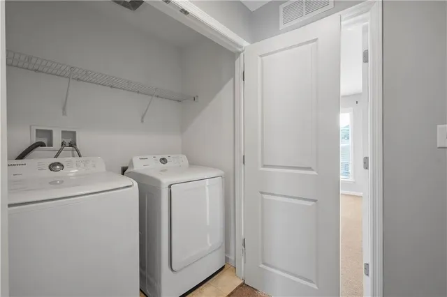 a utility room with dryer and washer