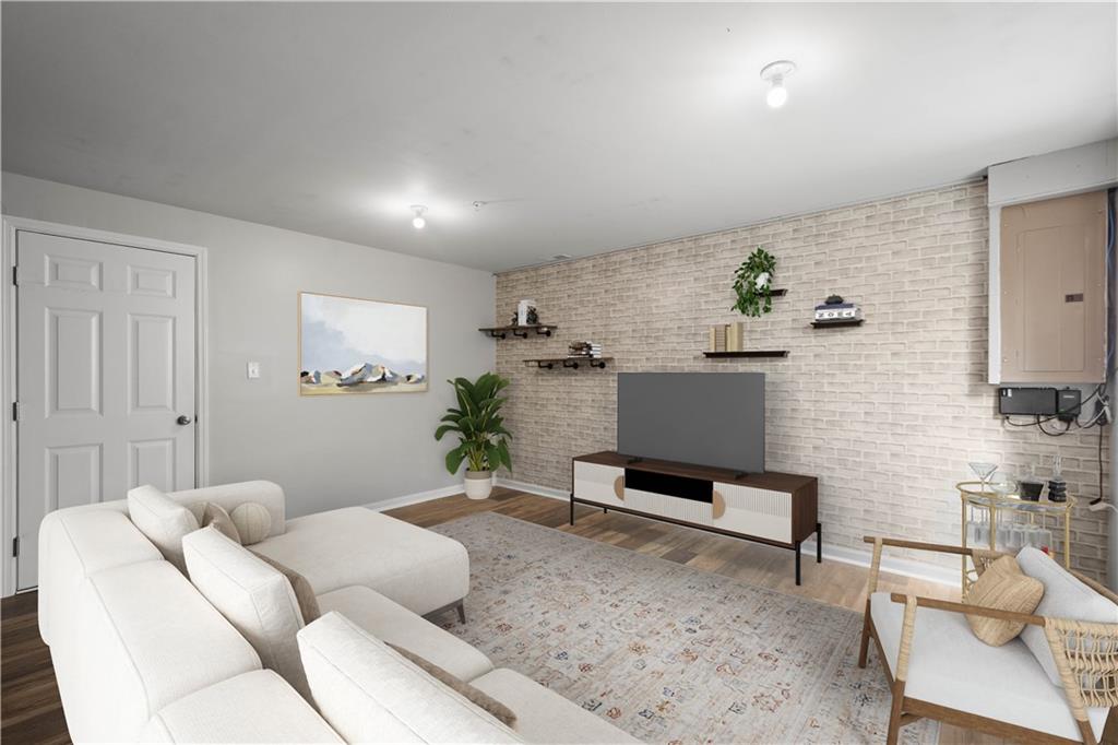 2013 Ashton Row Bridgeville, PA 15017 - Photo 27 of 33 a living room with furniture and a potted plant
