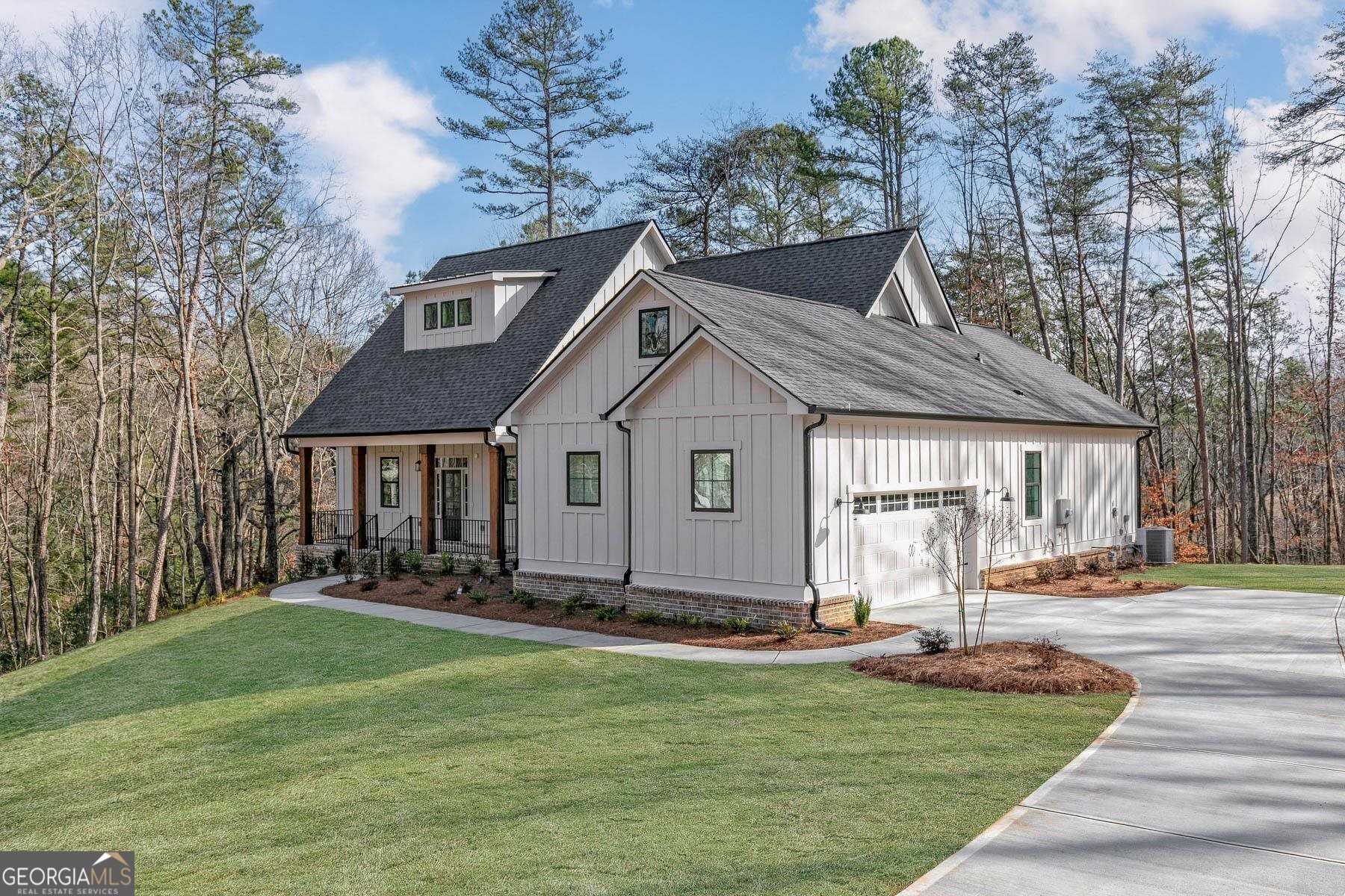 913 Oxford Road Ball Ground, GA 30107 - Photo 1 of 1 a front view of a house with a yard