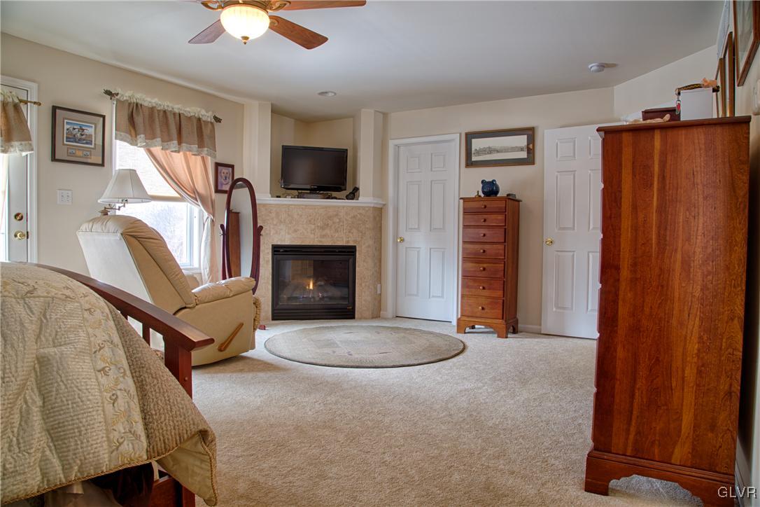 159 Heyer Road Nazareth, PA 18064 - Photo 7 of 20 a living room with furniture and a fireplace