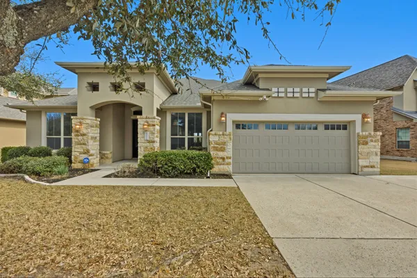 a front view of a building with garden