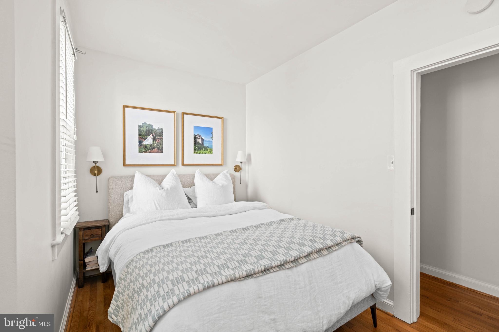 1656 Avon Place Northwest Washington, DC 20007 - Photo 15 of 20 a bedroom with a bed and a painting on the wall