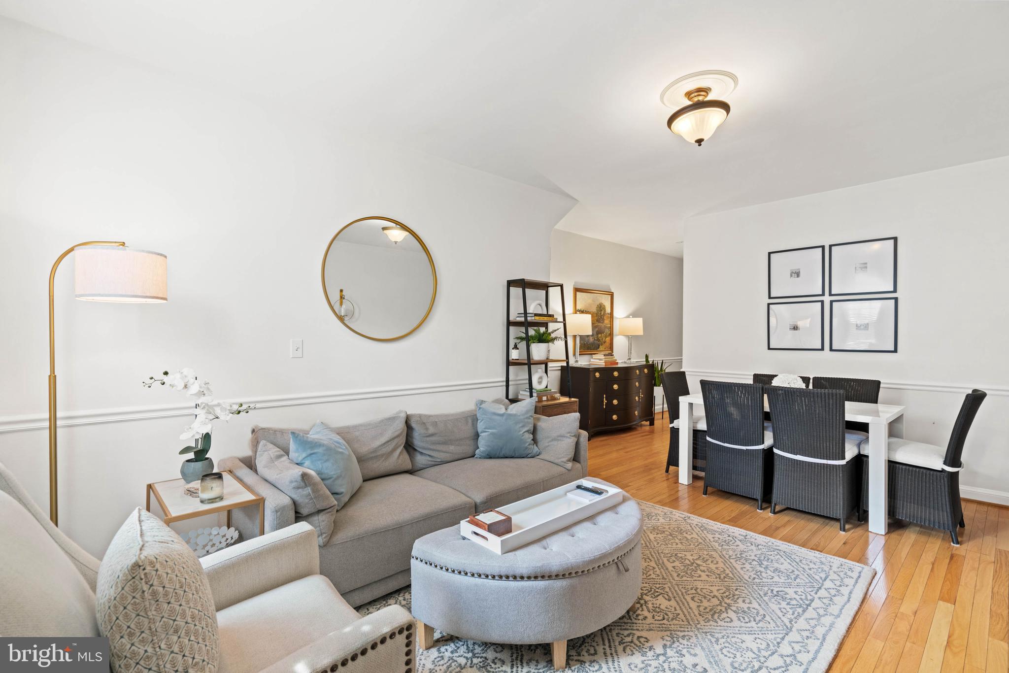 1656 Avon Place Northwest Washington, DC 20007 - Photo 3 of 20 a living room with furniture and wooden floor