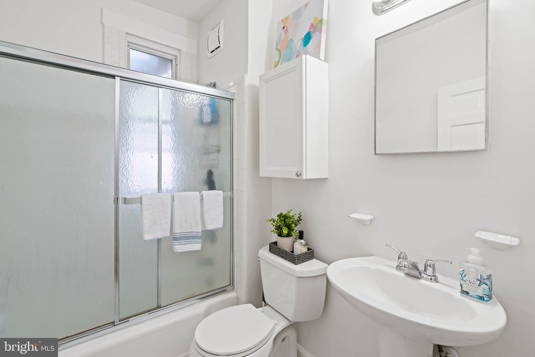 1656 Avon Place Northwest Washington, DC 20007 - Photo 7 of 20 a bathroom with a sink toilet and shower
