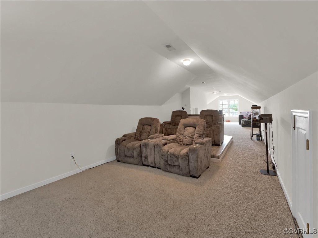 5512 Garden Grove Road Chesterfield, VA 23832 - Photo 46 of 48 Cinema room with vaulted ceiling and light carpet