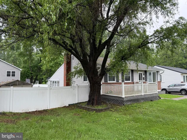 a view of house with backyard