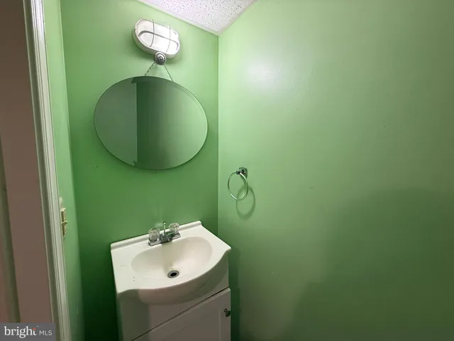 a bathroom with a sink and mirror