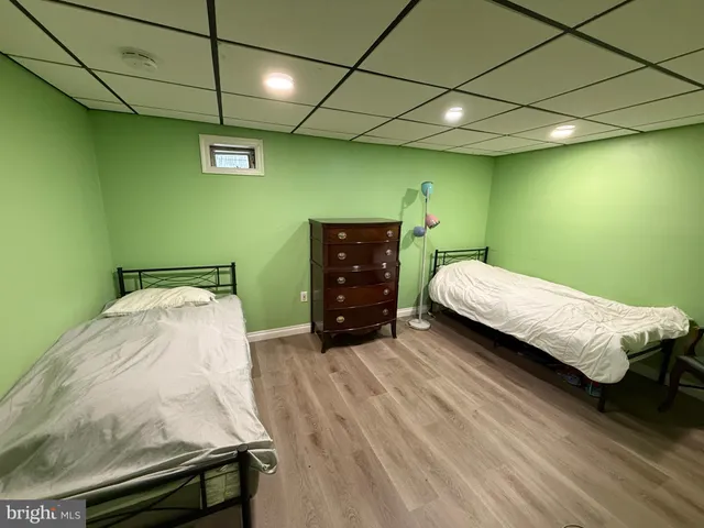 a bedroom with a bed and a ceiling fan