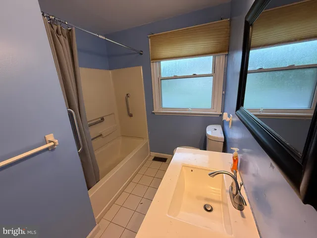 a view of pool with tree in the background