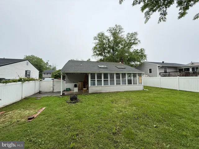 a house view with a sitting space and garden