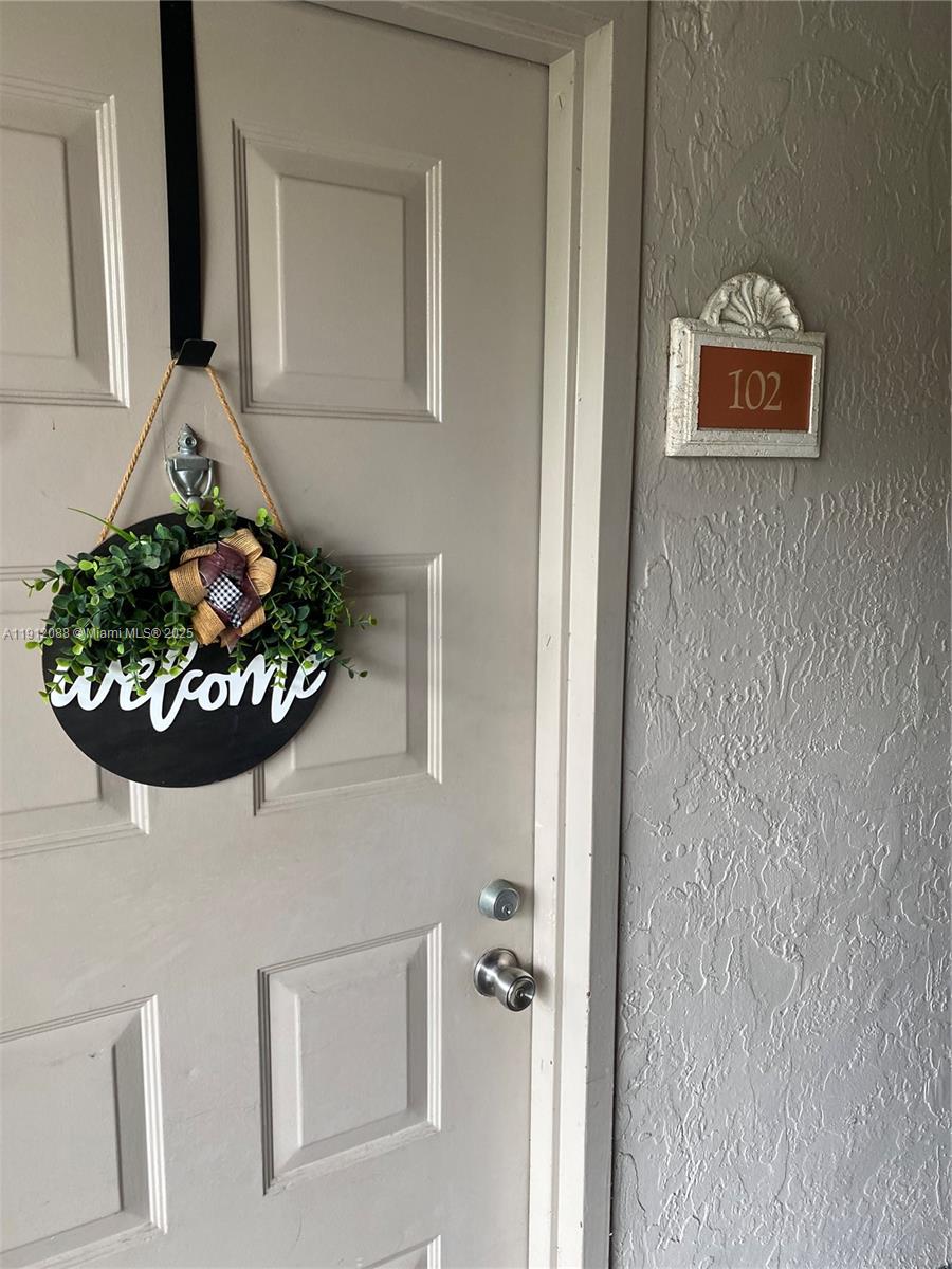 8235 Lake Drive, Unit 102 Doral, FL 33166 - Photo 5 of 8 a bathroom with a sink and a mirror