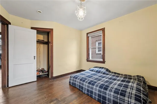 a bedroom with bed and window