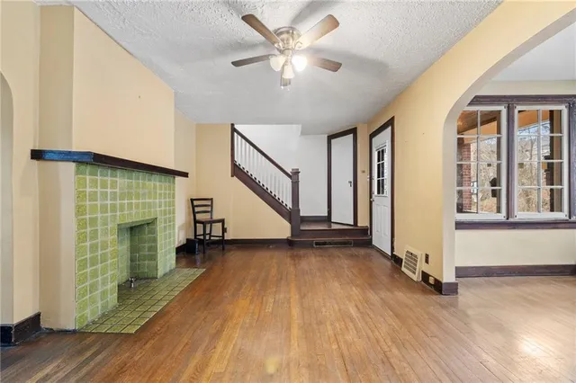 a view of an entryway with wooden floor