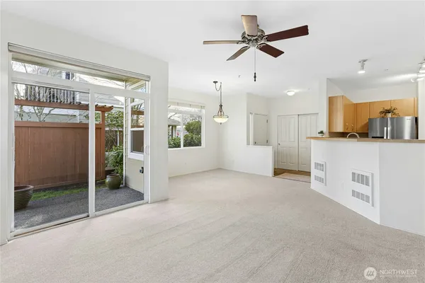 a view of a room with a painting on the wall