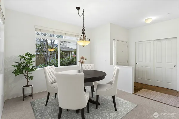 a kitchen with stainless steel appliances granite countertop a stove a microwave and cabinets