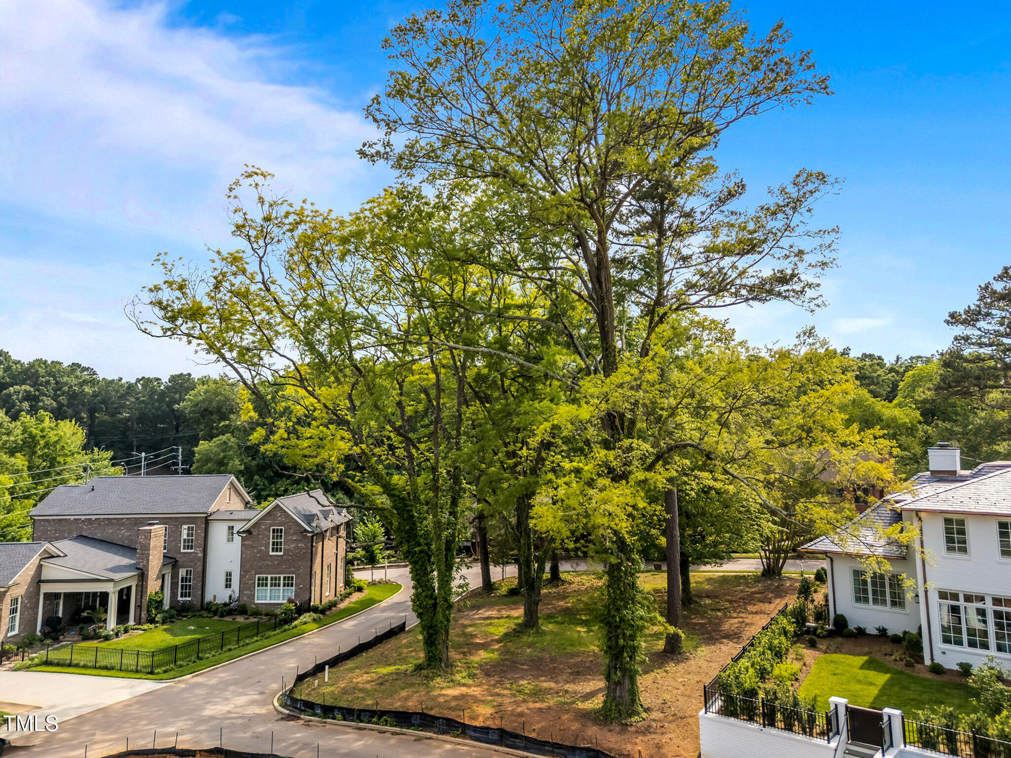 1504 Caswell Street Raleigh, NC 27608 - Photo 2 of 8 a front view of a multi story residential apartment building with a yard