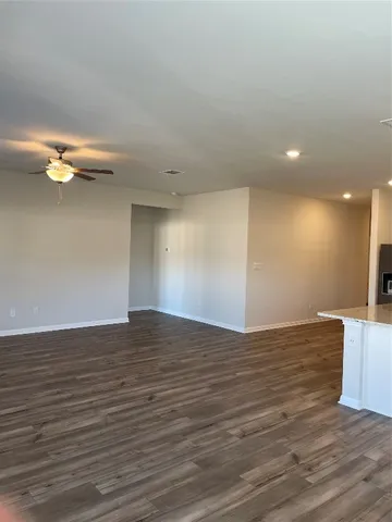 a view of a kitchen with a sink stainless steel appliances and cabinets