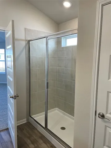 a view of room with a ceiling fan and window