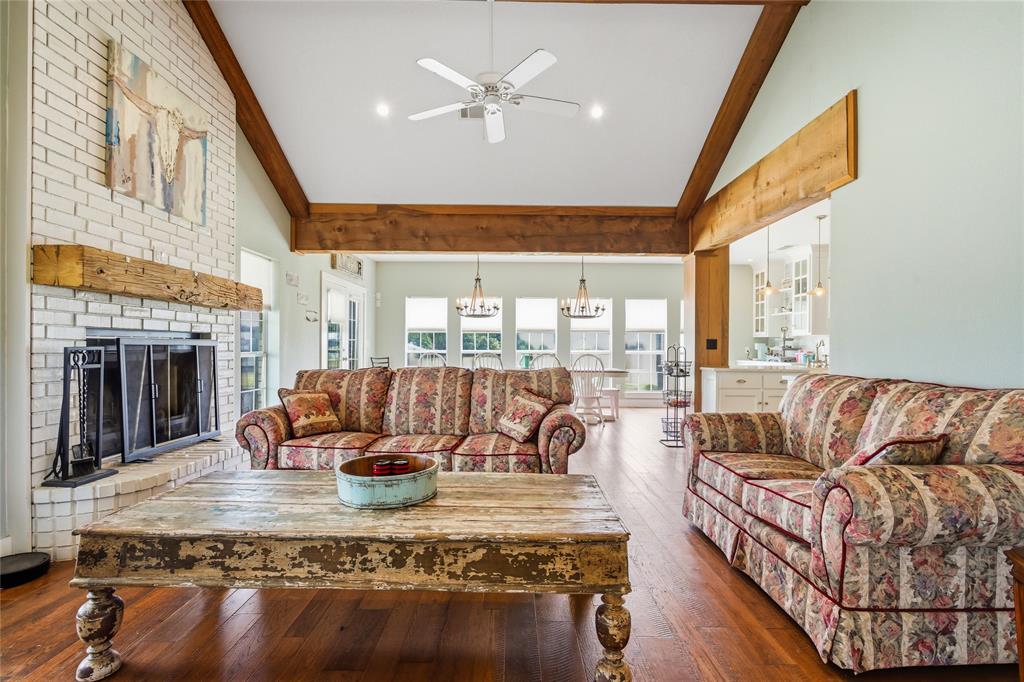 1073 Gordonville Road Gordonville, TX 76245 - Photo 11 of 38 An open living joins the two sides of the home. A fireplace and gorgeous wood accents give the room a comfortable feeling.
