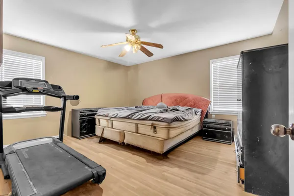 a bedroom with bed and a closet