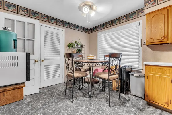 a large kitchen with stainless steel appliances granite countertop a sink and cabinets