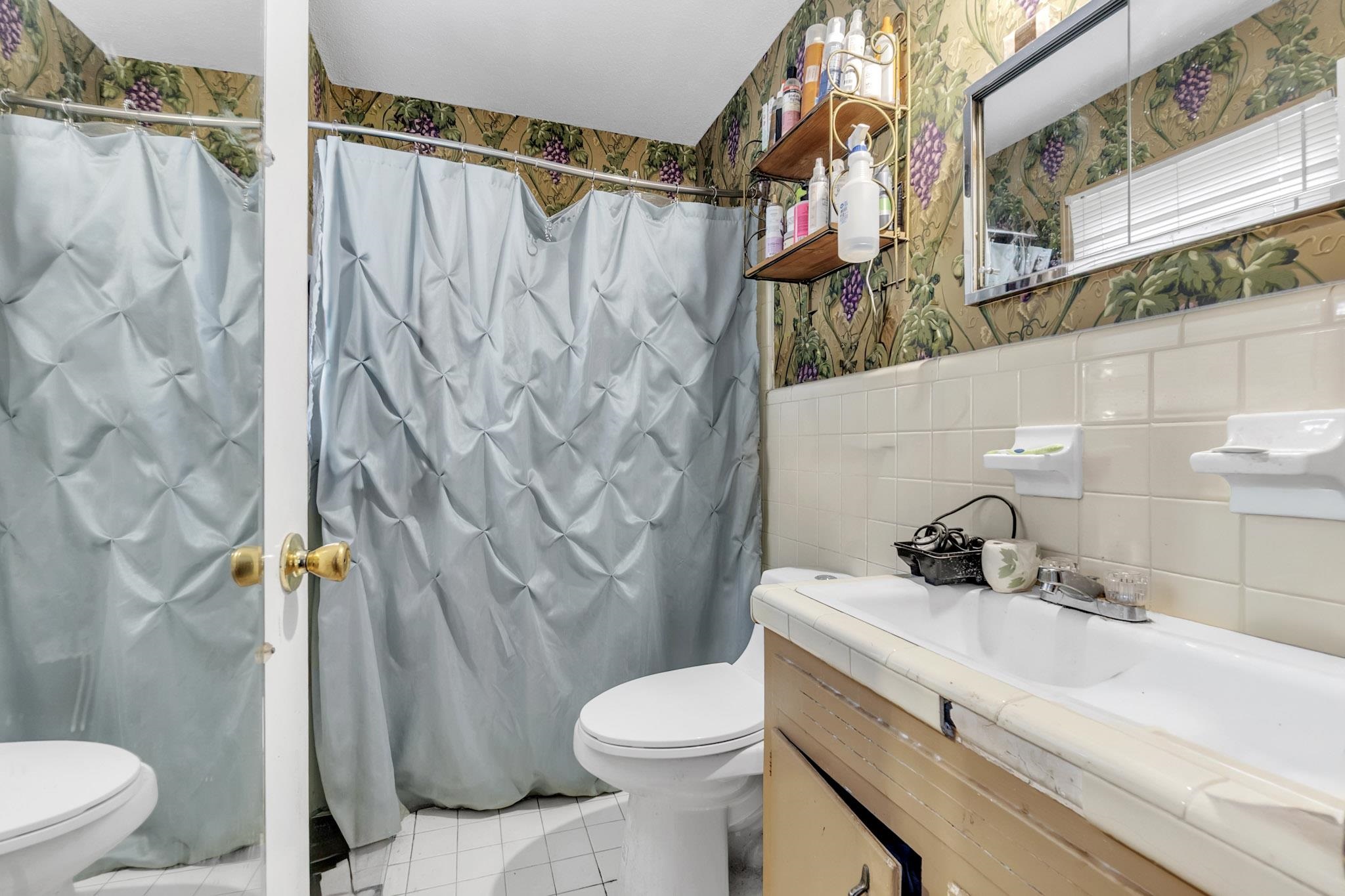 3595 Huckleberry Street Memphis, TN 38116 - Photo 19 of 19 a bathroom with a sink toilet and shower