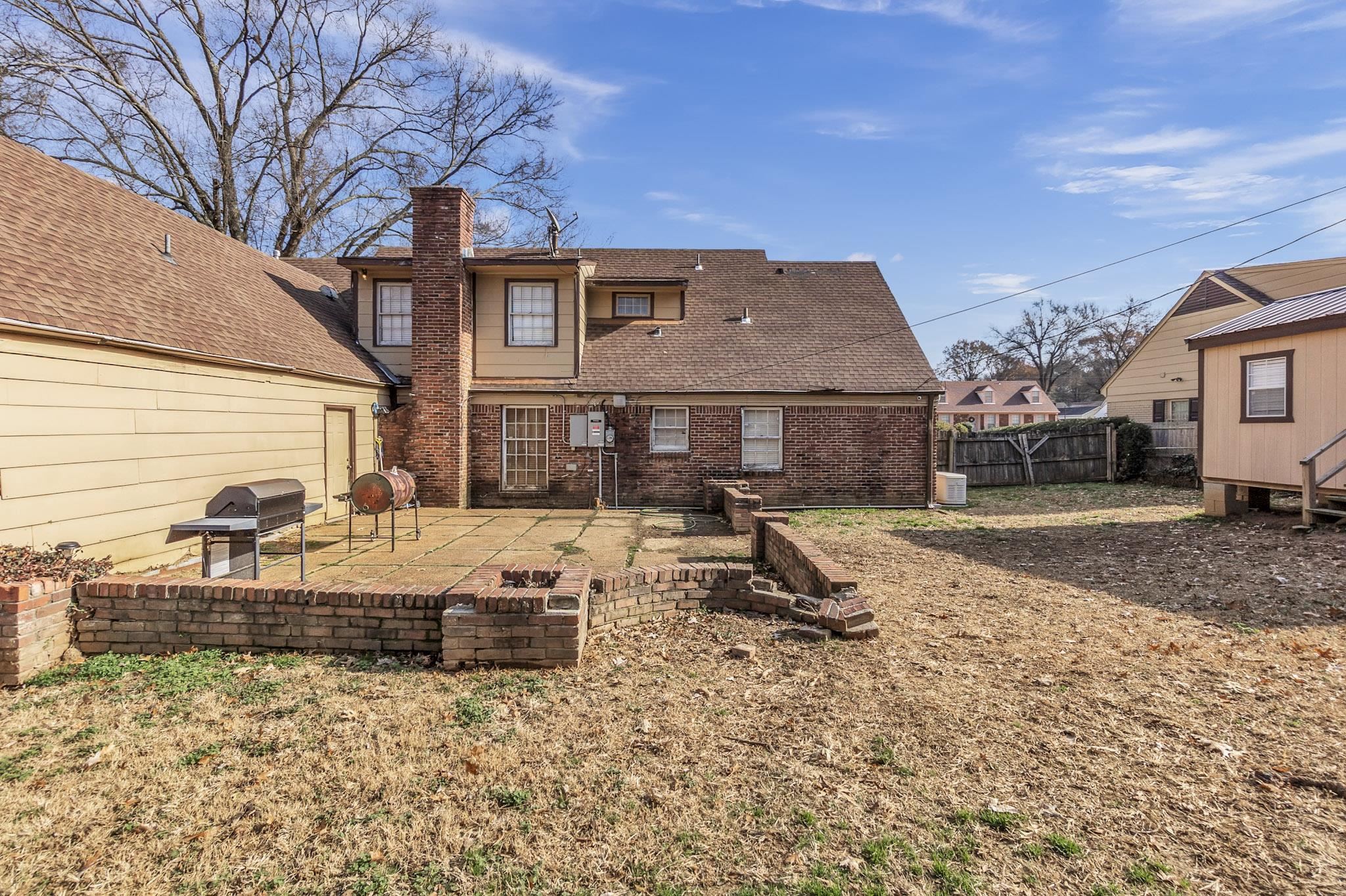 3595 Huckleberry Street Memphis, TN 38116 - Photo 6 of 19 a view of a house with backyard and sitting area