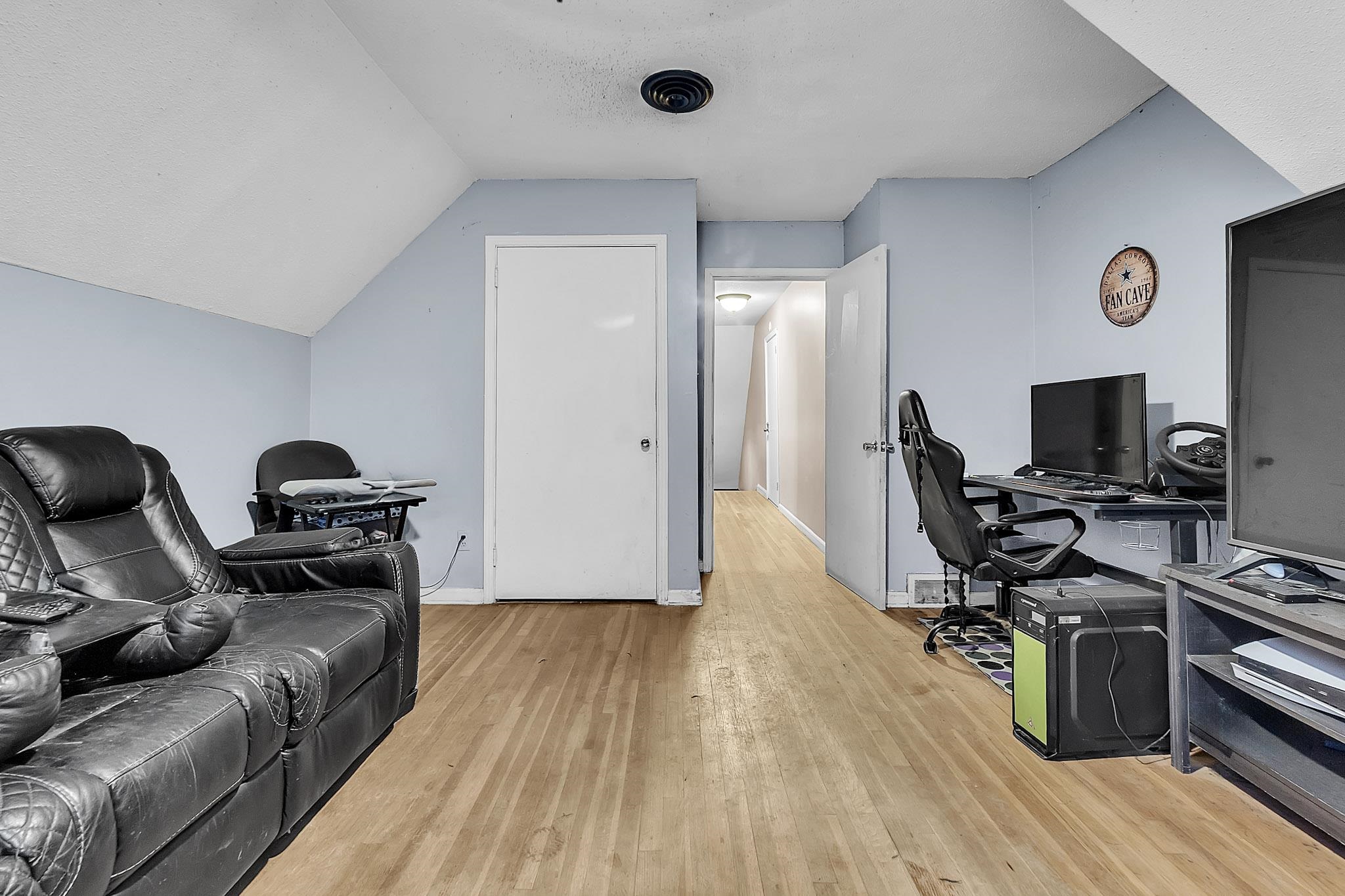 3595 Huckleberry Street Memphis, TN 38116 - Photo 7 of 19 a view of a workspace with furniture and wooden floor