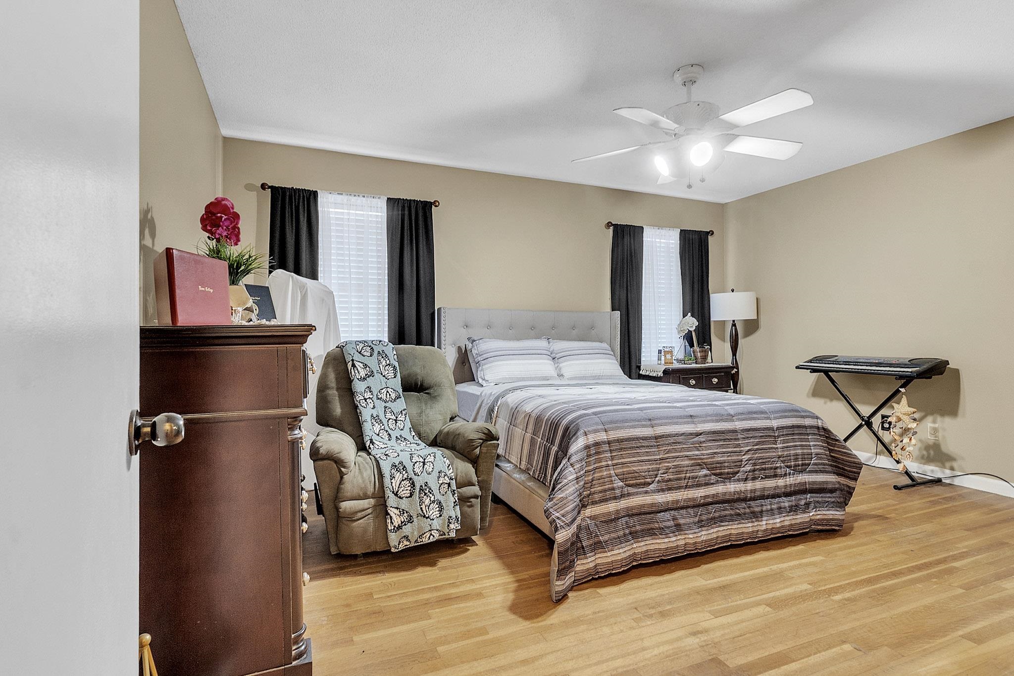 3595 Huckleberry Street Memphis, TN 38116 - Photo 9 of 19 a bedroom with a bed and a chandelier