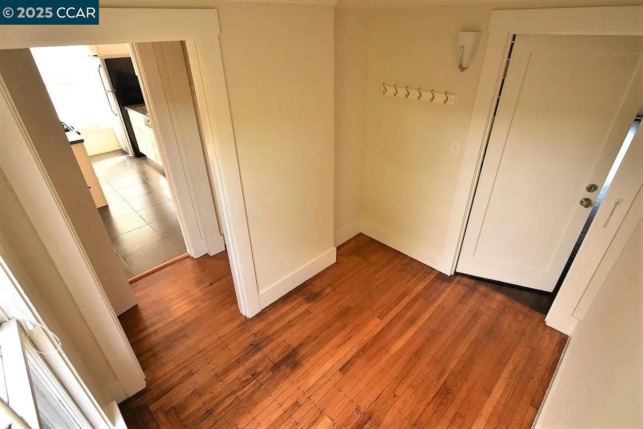 3040 Telegraph Avenue, Unit 4 Berkeley, CA 94705 - Photo 6 of 8 a view of front door with wooden floor