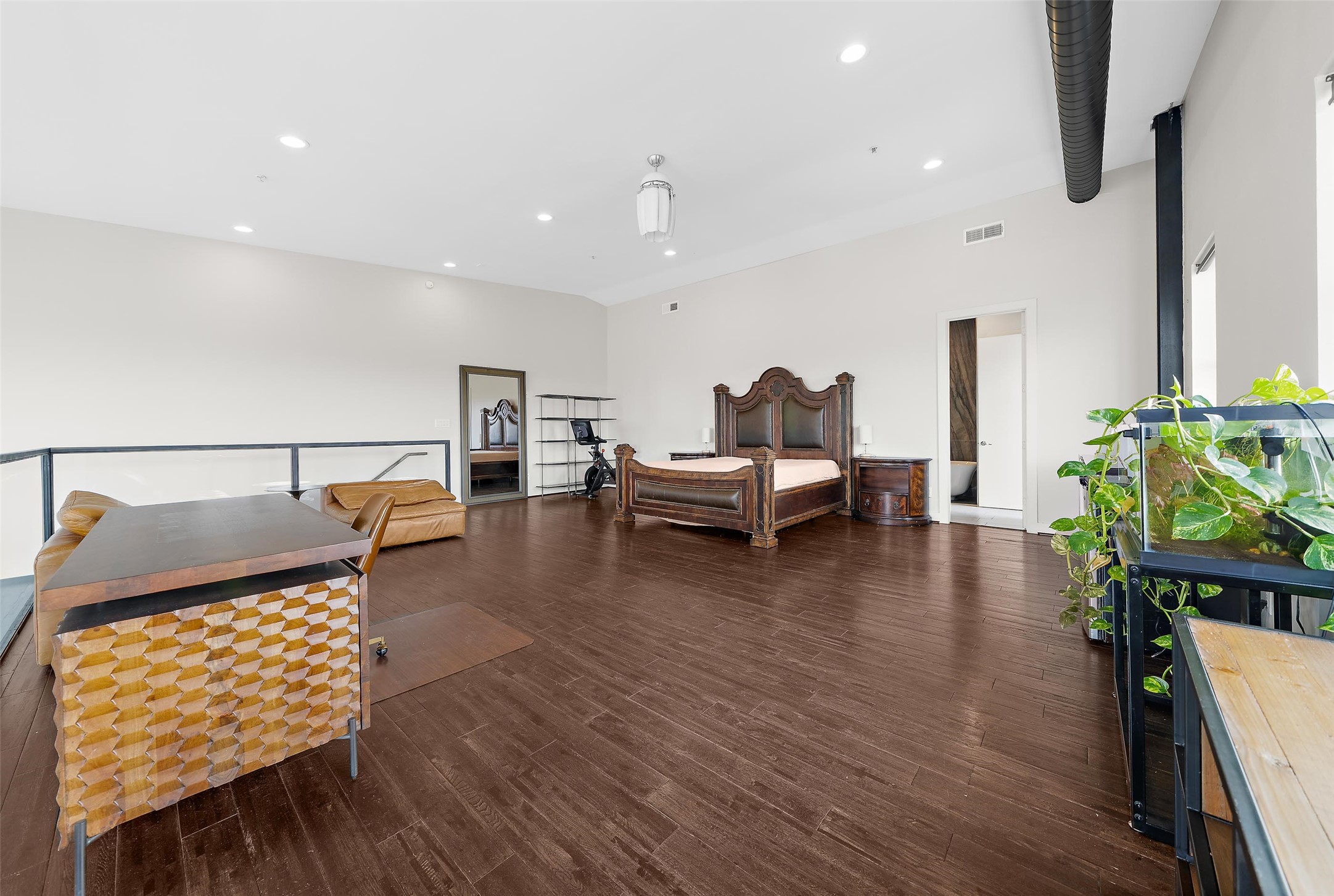 2323 Polk Street, Unit 306 Houston, TX 77003 - Photo 12 of 32 a living room with furniture and wooden floor