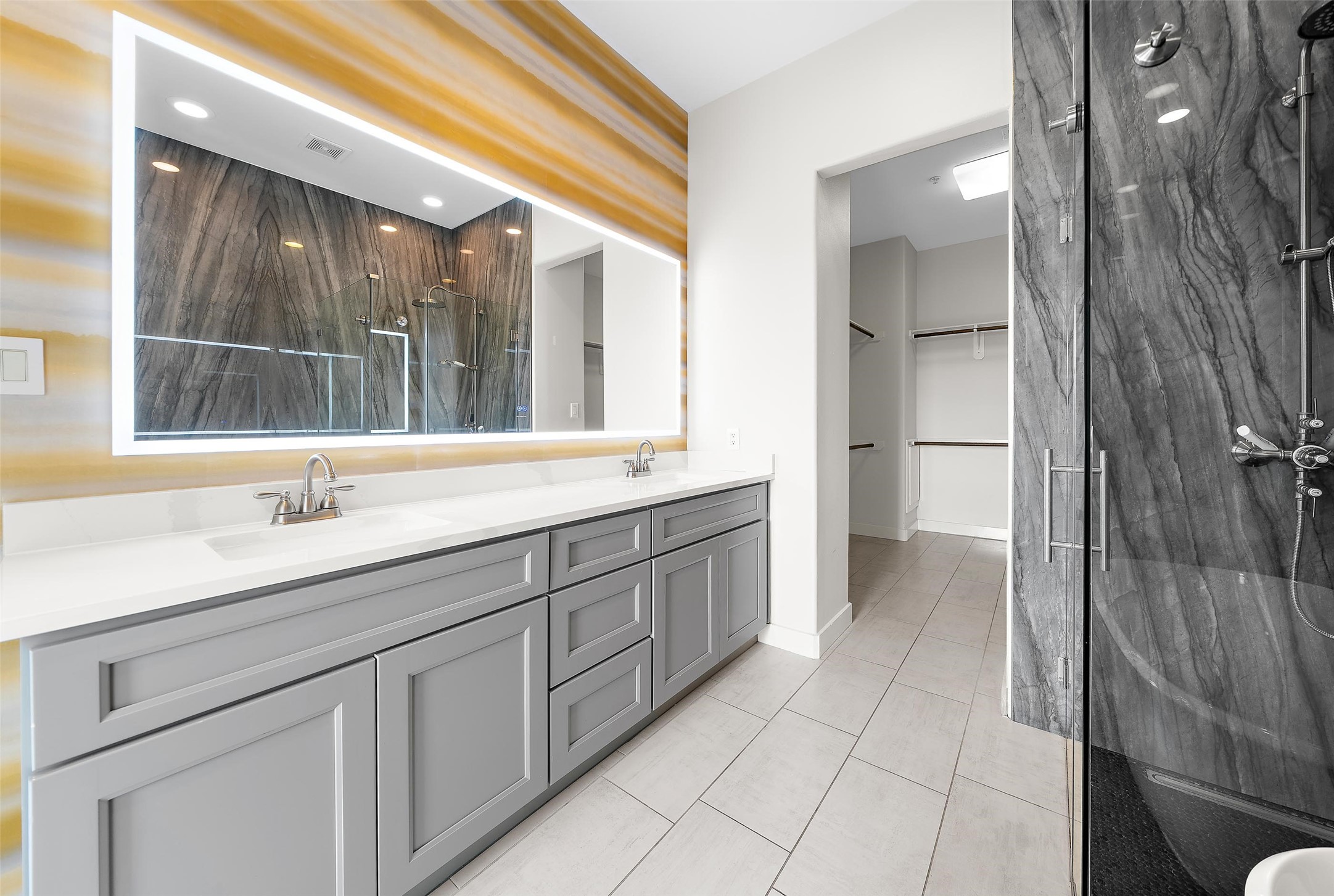 2323 Polk Street, Unit 306 Houston, TX 77003 - Photo 15 of 32 a bathroom with a double vanity sink and a mirror