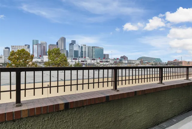 a view of a balcony with city view
