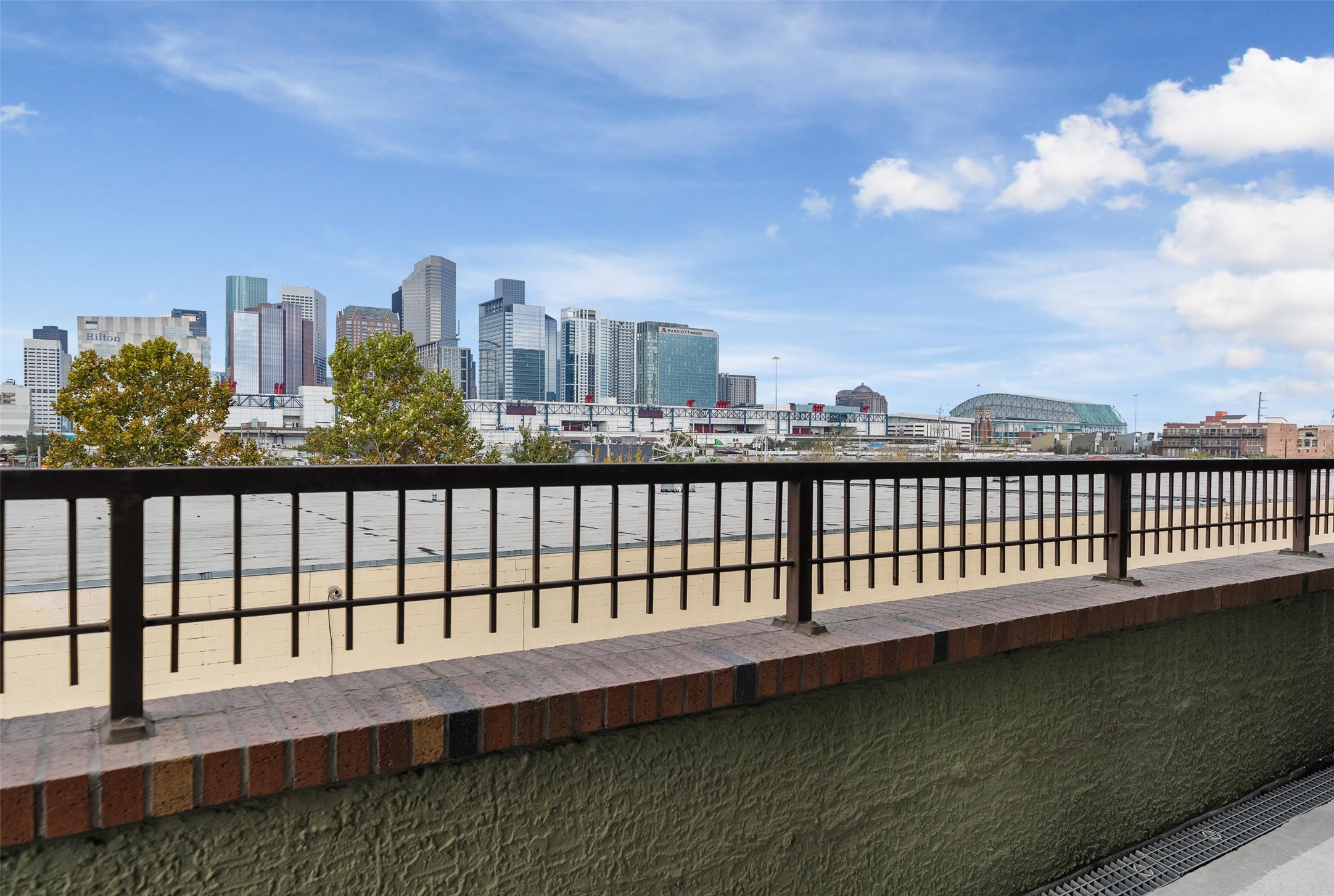2323 Polk Street, Unit 306 Houston, TX 77003 - Photo 17 of 32 a view of a city street from a balcony