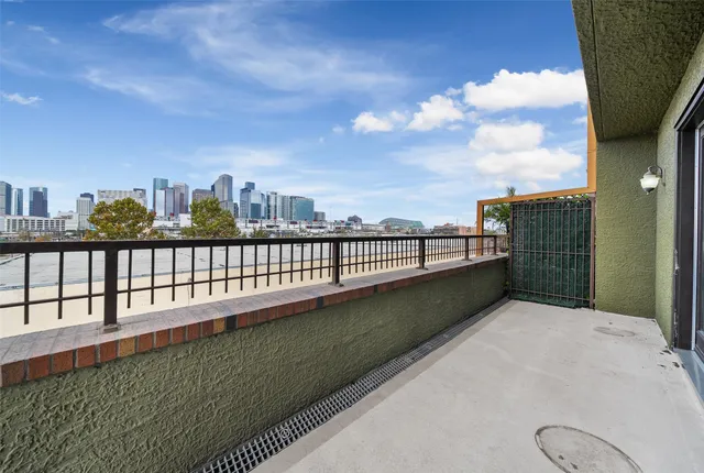 a view of a patio with a table and chairs