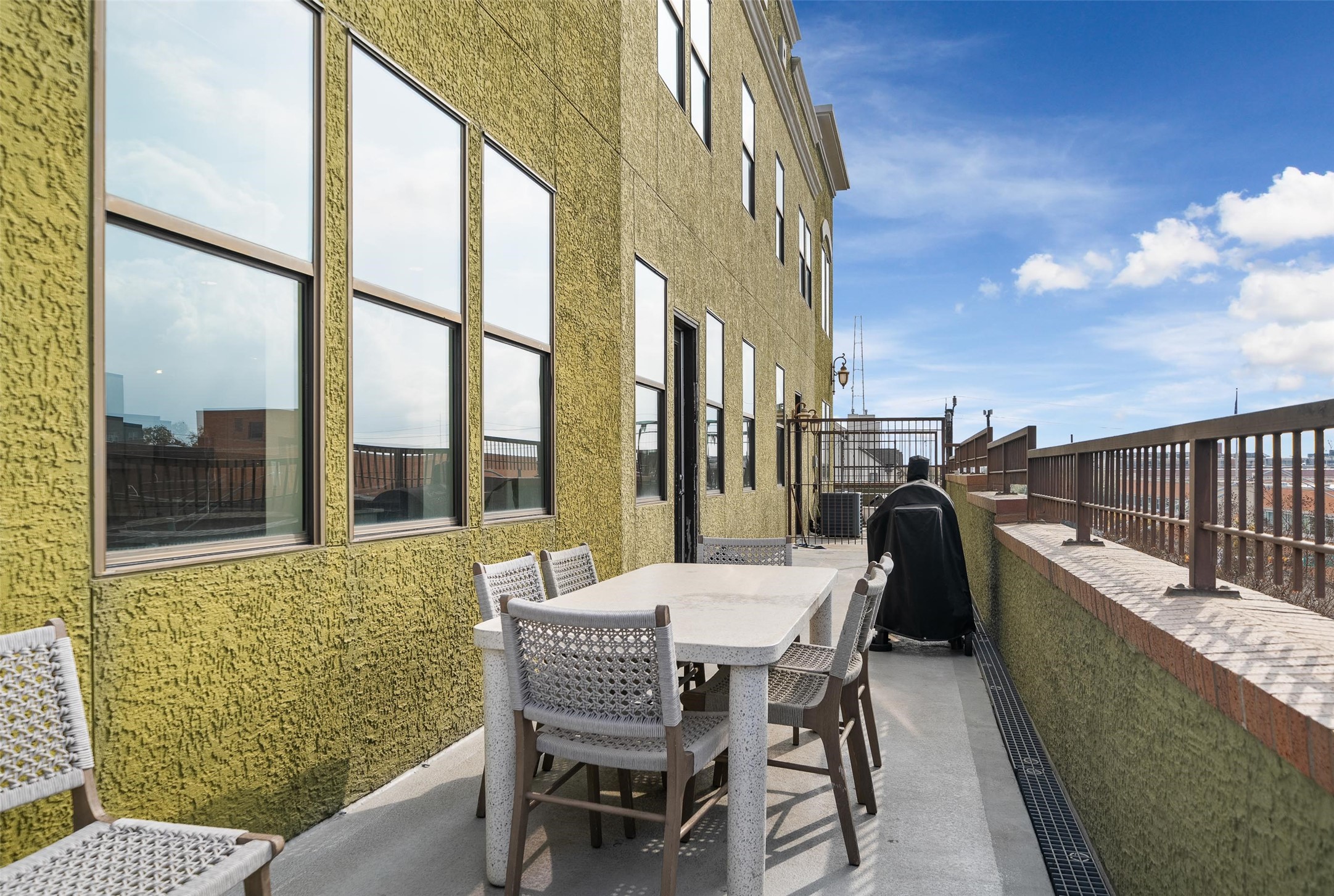 2323 Polk Street, Unit 306 Houston, TX 77003 - Photo 21 of 32 a balcony with table and chairs