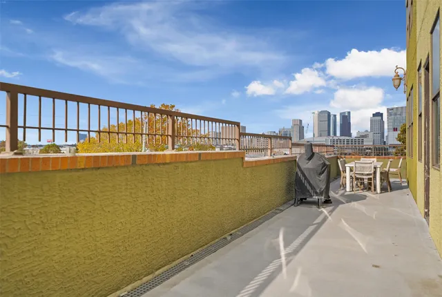 a view of balcony with furniture