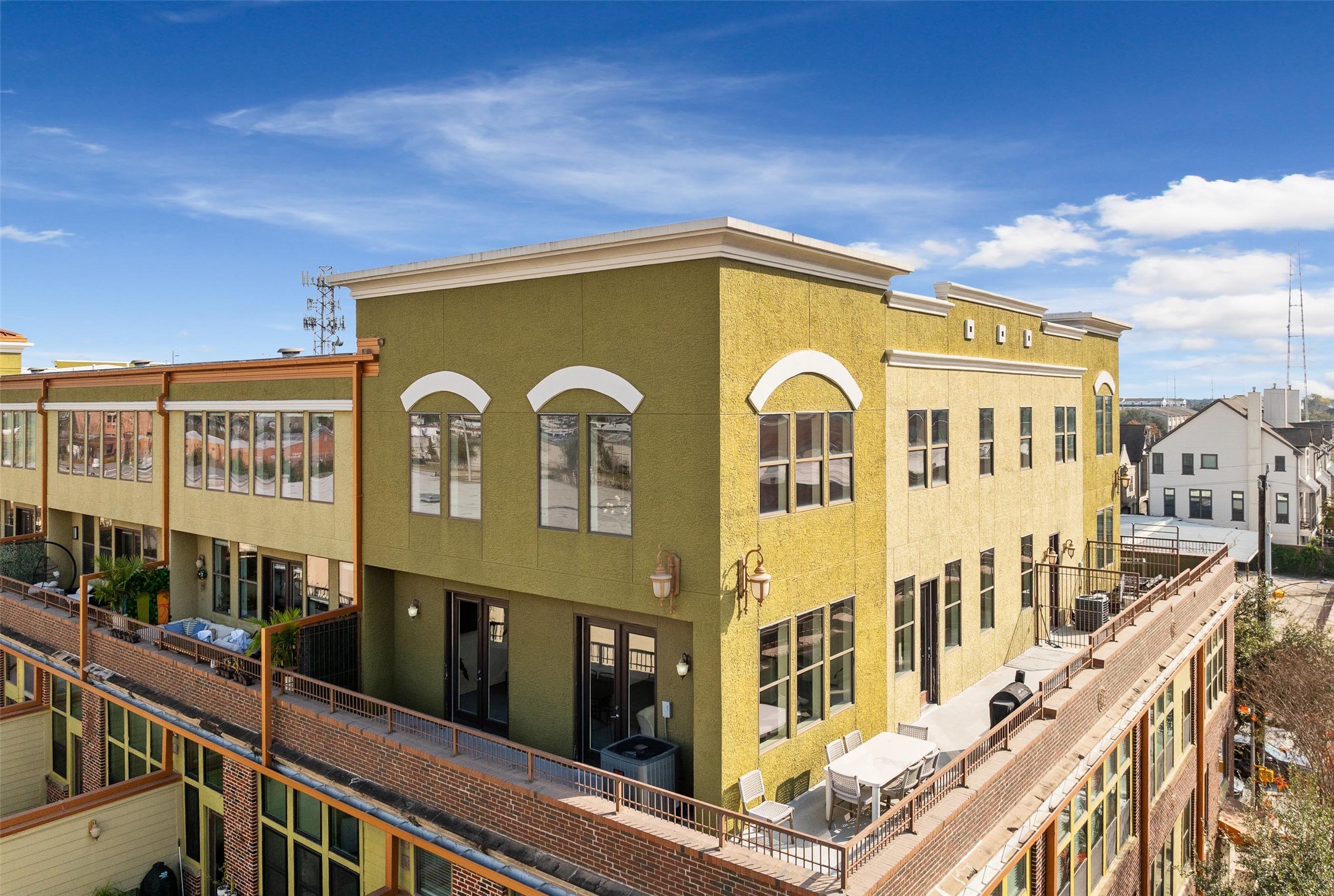 2323 Polk Street, Unit 306 Houston, TX 77003 - Photo 25 of 32 a view of a blue house with large windows