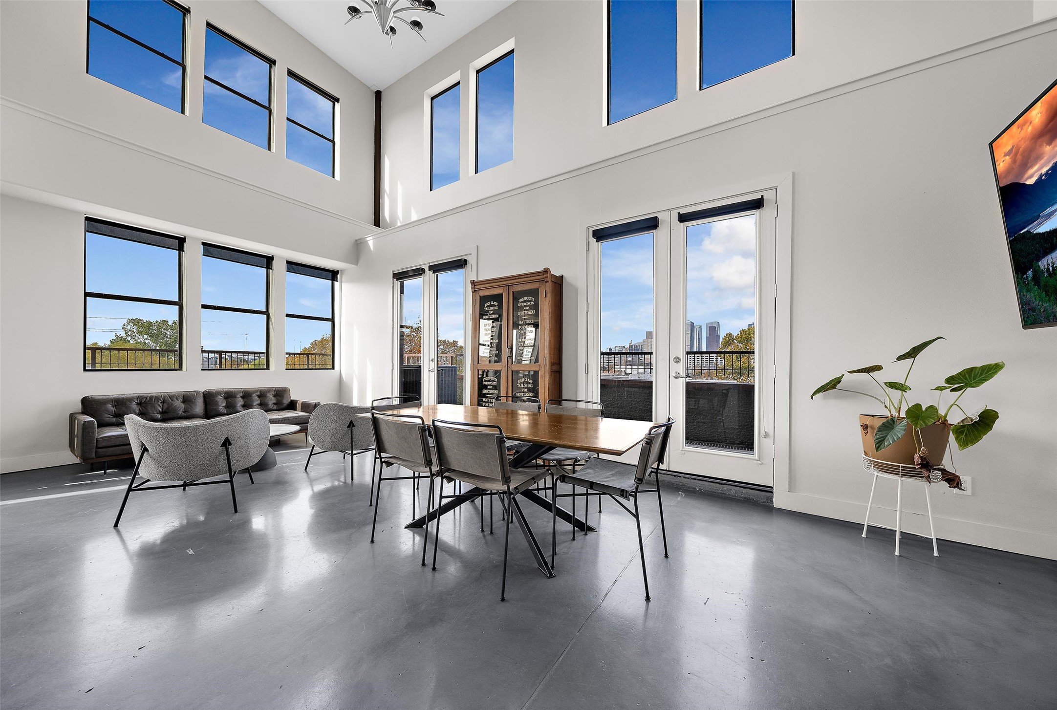 2323 Polk Street, Unit 306 Houston, TX 77003 - Photo 3 of 32 a view of a dining room with furniture window and wooden floor