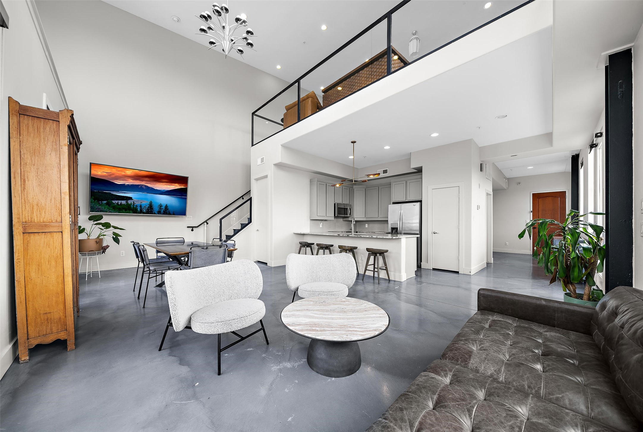 2323 Polk Street, Unit 306 Houston, TX 77003 - Photo 4 of 32 a living room with furniture and a flat screen tv