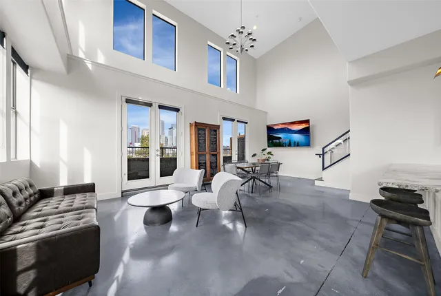 a living room with furniture and white walls
