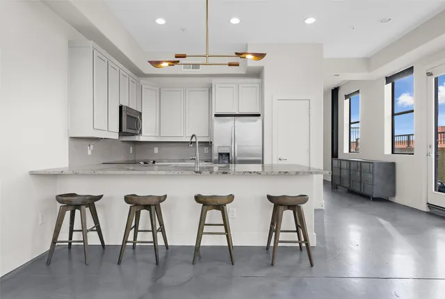 a bed room with furniture and a table