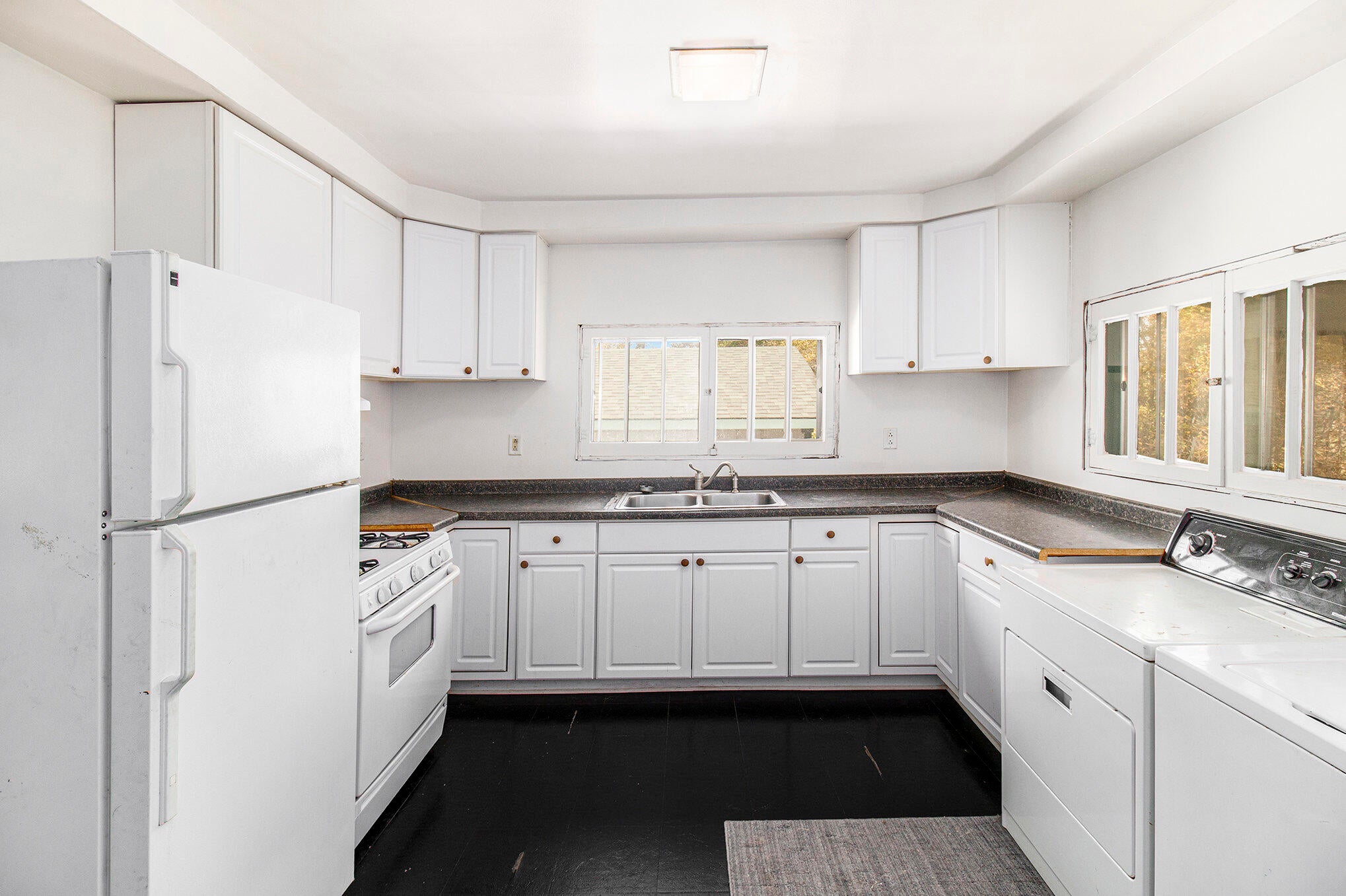 111 Bell Street Cheboygan, MI 49721 - Photo 10 of 27 Kitchen & Laundry Room