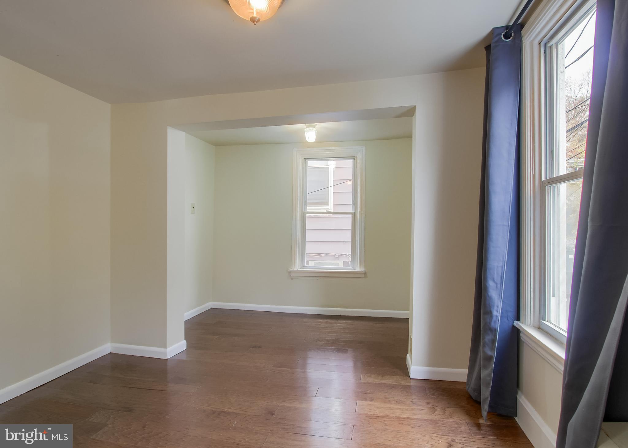 342 South 3rd Street Steelton, PA 17113 - Photo 15 of 25 a view of an empty room with wooden floor and a window