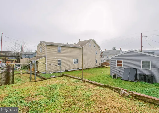 a view of a backyard of the house