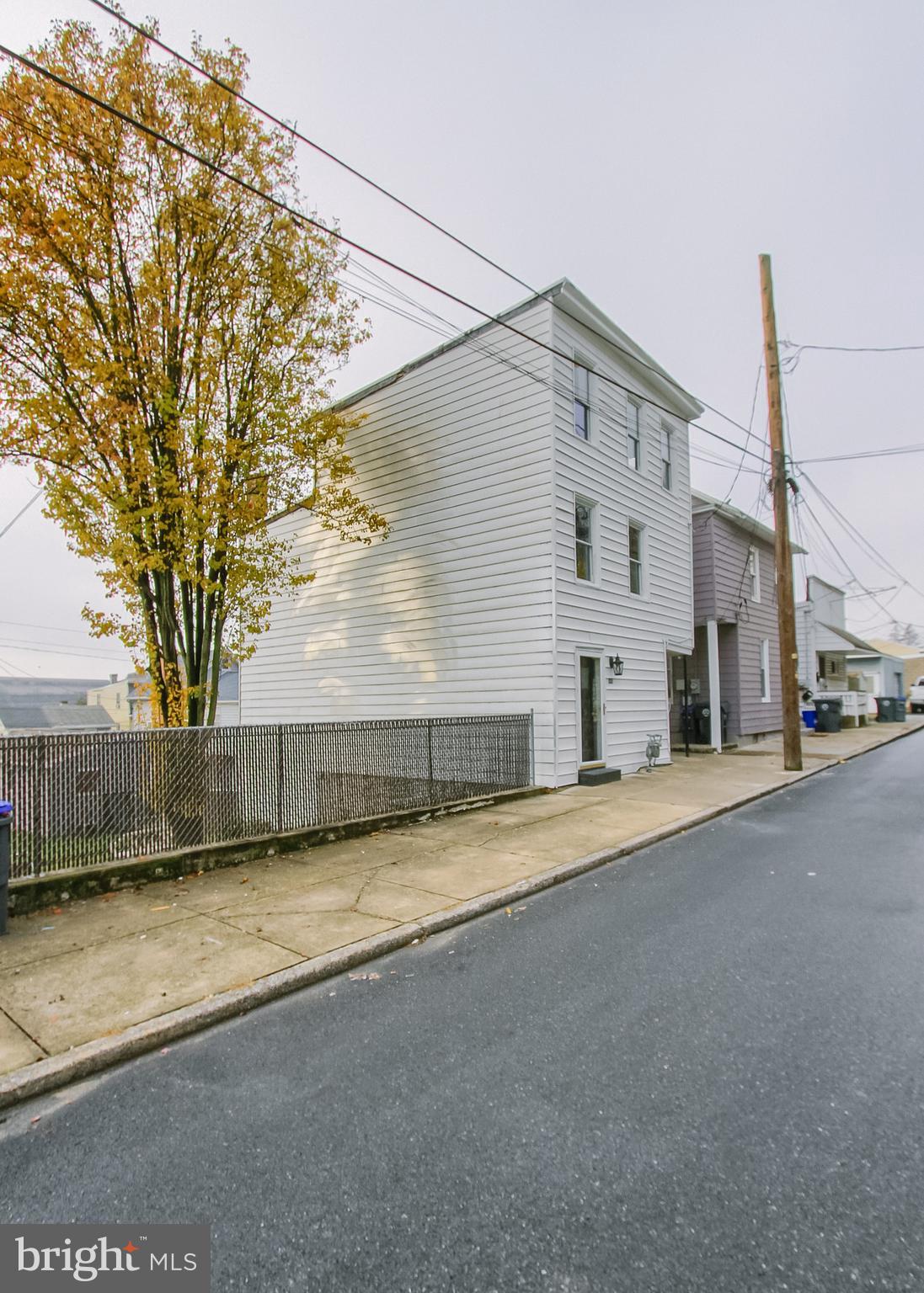 342 South 3rd Street Steelton, PA 17113 - Photo 25 of 25 a front view of a house with a yard and garage